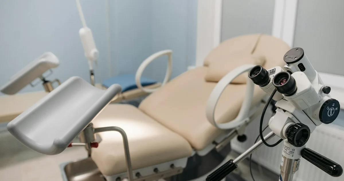 A sterile and well-equipped medical examination room with a focus on precision instruments.